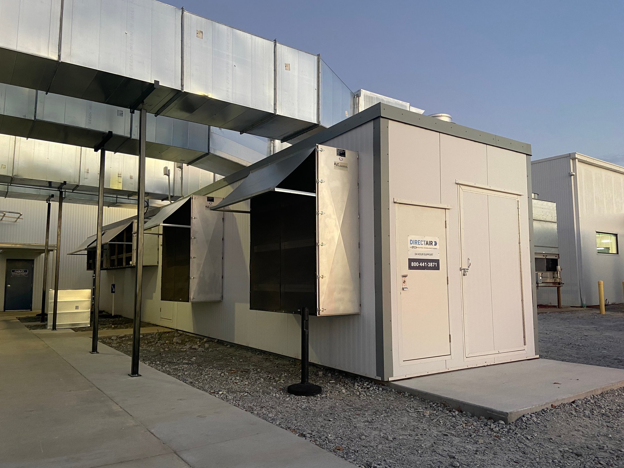 A photograph of the exterior of a DIRECTAIR Factory unit assembled outside of a factory showing the size and how DIRECTAIR gives customers space back within their plant