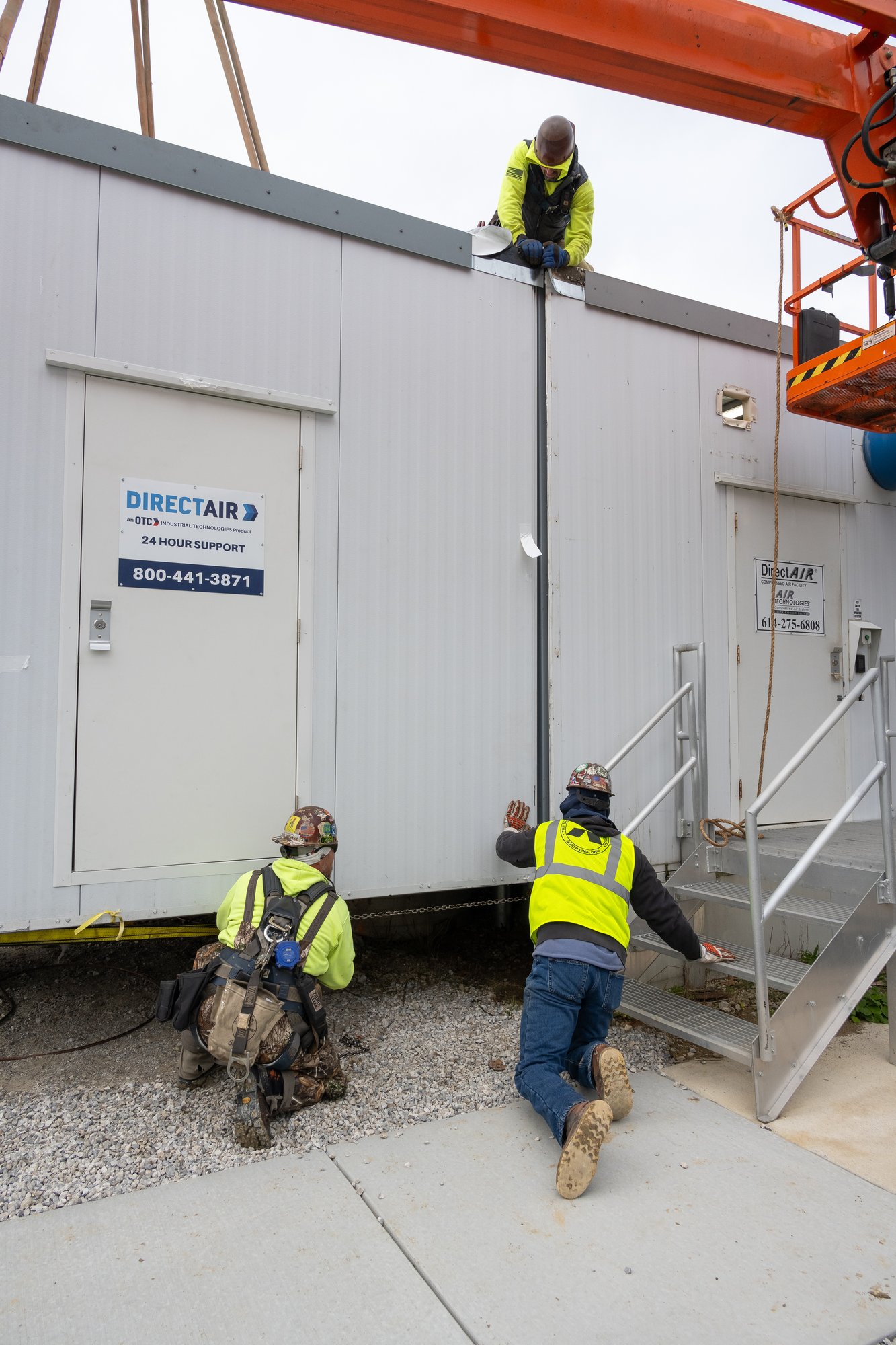 Two DIRECTAIR workers setting up a DIRECTAIR unit on site at an Industrial plant