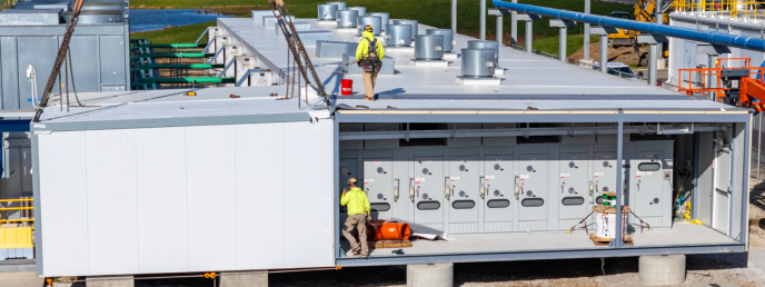 Workers setting up a DIRECTAIR Industrial site, showing the inside of a DIRECTAIR building